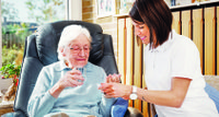 Nurse caring for elderly person