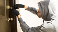 profile-view-man-with-hoodie-trying-pick-lock-house-forcing-his-entry_web.jpg